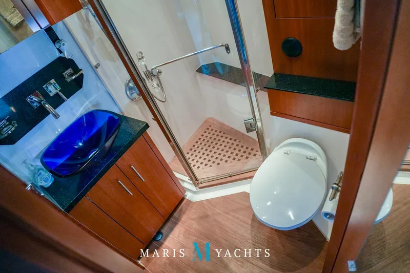  Yacht Photos Pics Luxurious bathroom in 2009 Regal 52 Sport Coupe yacht with modern fixtures.