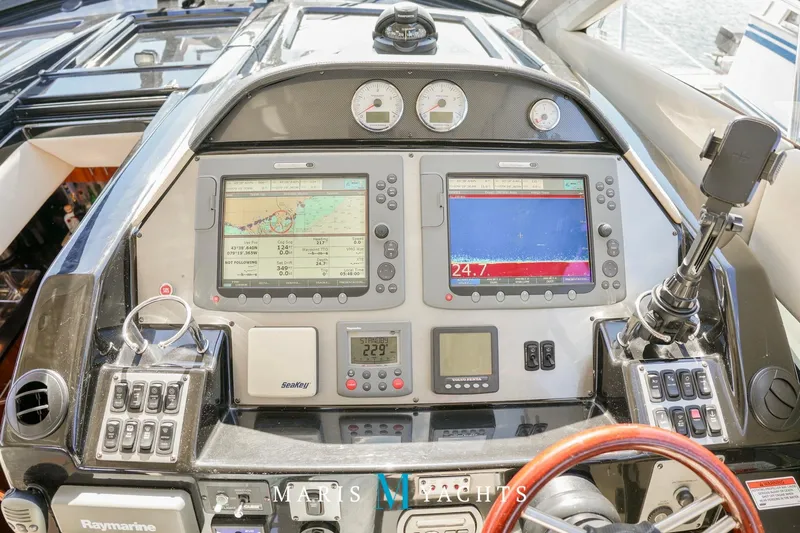  Yacht Photos Pics Cockpit of 2009 Regal 52 Sport Coupe with navigation displays and controls.