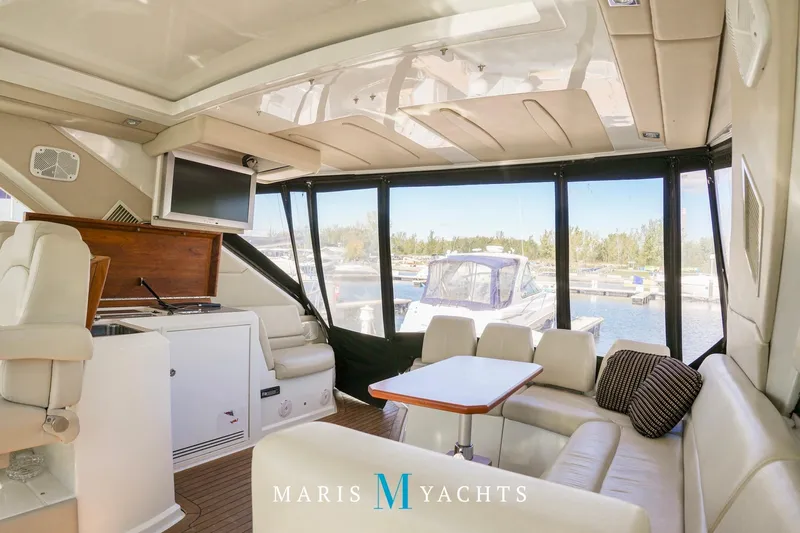  Yacht Photos Pics Luxurious interior of 2009 Regal 52 Sport Coupe yacht with marina view.