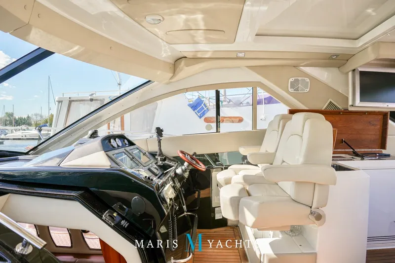  Yacht Photos Pics Interior of 2009 Regal 52 Sport Coupe yacht with modern helm and seating.