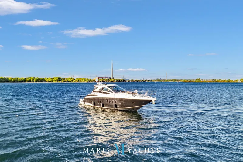  Yacht Photos Pics 2009 Regal 52 Sport Coupe yacht cruising on a sunny day.