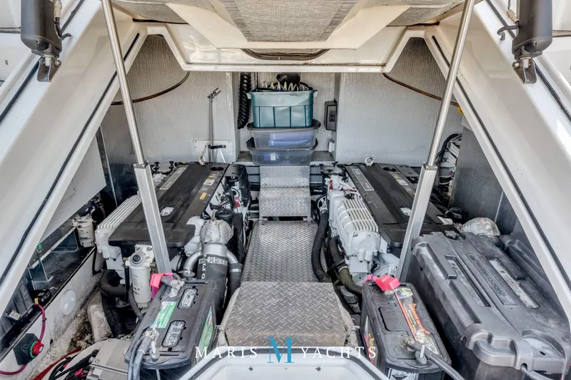  Yacht Photos Pics Engine room of 2009 Regal 52 Sport Coupe yacht, showcasing dual engines and storage.
