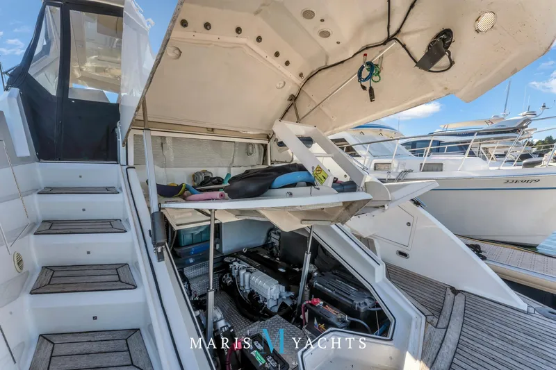  Yacht Photos Pics 2009 Regal 52 Sport Coupe yacht engine compartment with open hatch, docked at marina.