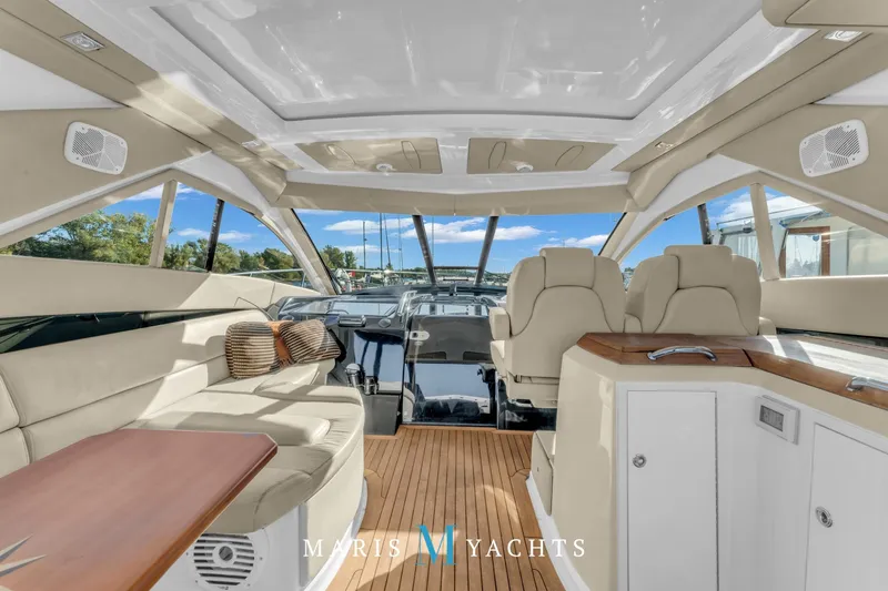  Yacht Photos Pics Luxurious interior of 2009 Regal 52 Sport Coupe yacht with plush seating and modern design.