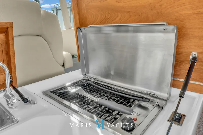  Yacht Photos Pics Luxury yacht grill area on 2009 Regal 52 Sport Coupe, featuring stainless steel design.