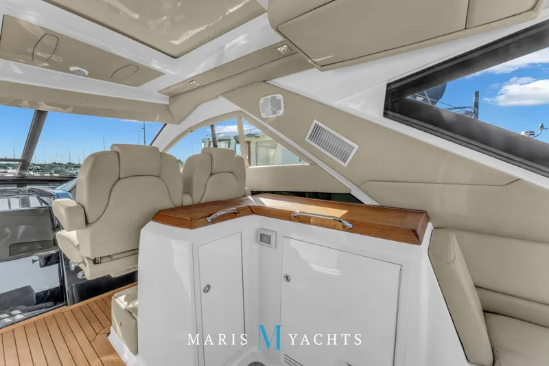  Yacht Photos Pics Luxurious interior of 2009 Regal 52 Sport Coupe yacht with plush seating and sleek design.