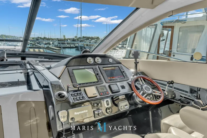  Yacht Photos Pics 2009 Regal 52 Sport Coupe yacht helm with advanced navigation systems and luxurious design.