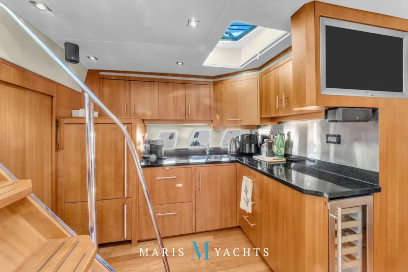  Yacht Photos Pics Luxurious kitchen interior of 2009 Regal 52 Sport Coupe yacht with modern amenities.