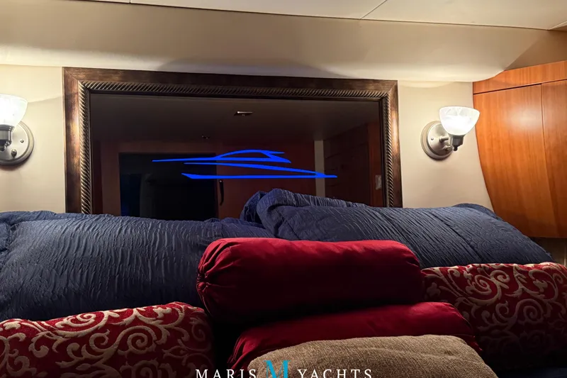  Yacht Photos Pics Luxurious interior of 2009 Regal 52 Sport Coupe yacht with elegant bedding and lighting.