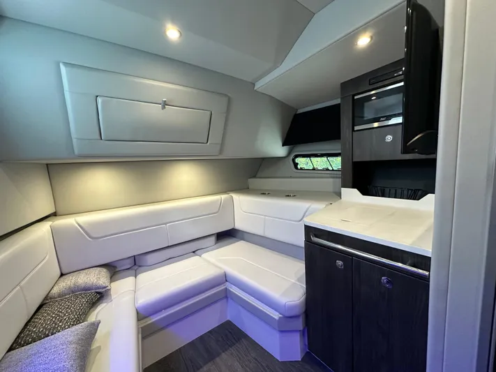 Harvest Time Yacht Photos Pics 2022 Formula 380 Super Sport Crossover interior with modern seating and cabinetry.
