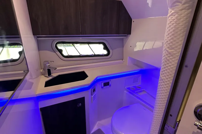 Harvest Time Yacht Photos Pics 2022 Formula 380 Super Sport Crossover bathroom with modern design and blue LED lighting.