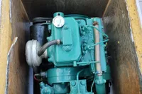 Engine compartment of a 2023 Custom Snipa, showcasing a green marine engine.