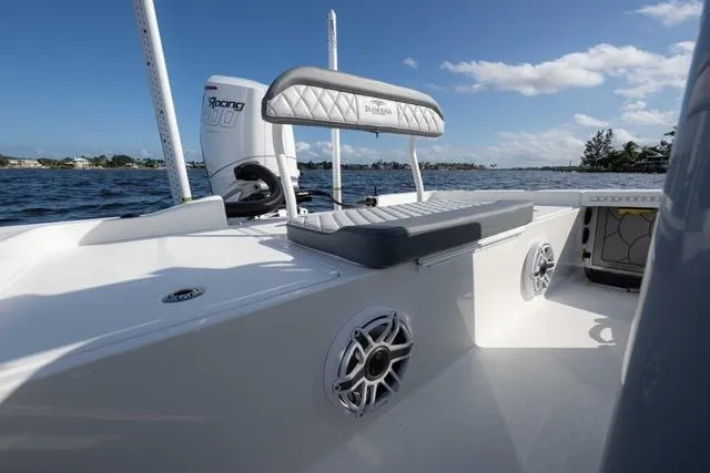  Yacht Photos Pics 2024 Islamorada Boatworks 24 on water, featuring sleek seating and powerful engine.