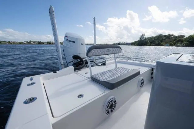  Yacht Photos Pics 2024 Islamorada Boatworks 24 on water, featuring sleek design and powerful engine.