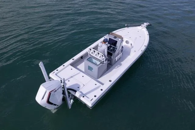  Yacht Photos Pics 2024 Islamorada Boatworks 24 on water, featuring sleek design and modern outboard motor.