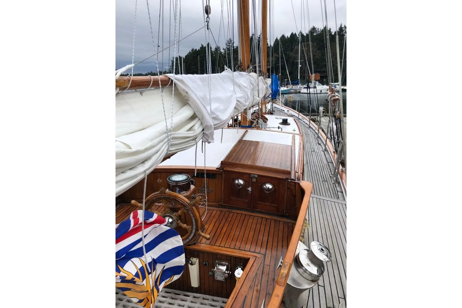 1966 Allen Mackay Gaff Rigged Top Sail Schooner with wooden deck and colorful flag.