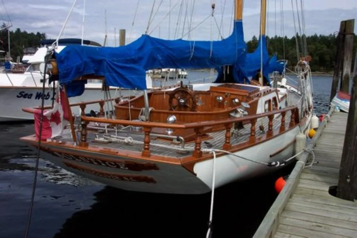 1966 Allen Mackay Gaff Rigged Top Sail Schooner docked with blue cover.