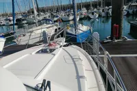 Nimbus Trawler 37, 1996 model, docked in a marina with other boats.