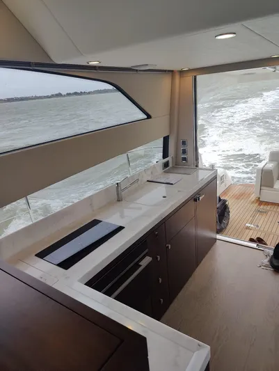 Waypoint Yacht Photos Pics 2024 Fairline Squadron 50 yacht interior with modern kitchen and ocean view.