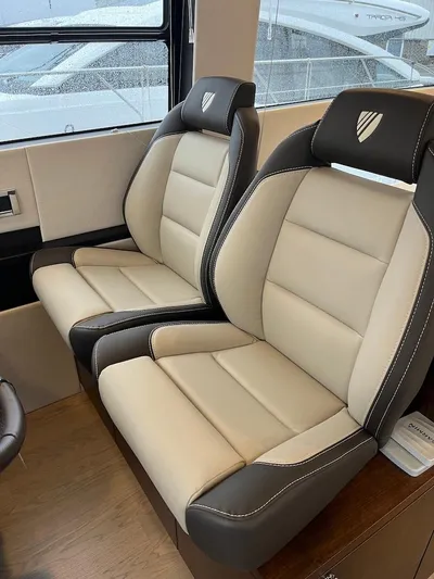 Waypoint Yacht Photos Pics 2024 Fairline Squadron 50 interior with luxurious beige and gray seating.