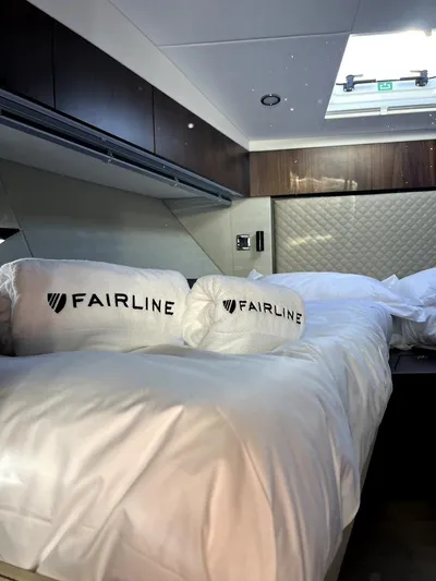 Waypoint Yacht Photos Pics Luxurious bedroom interior of 2024 Fairline Squadron 50 yacht with plush bedding.