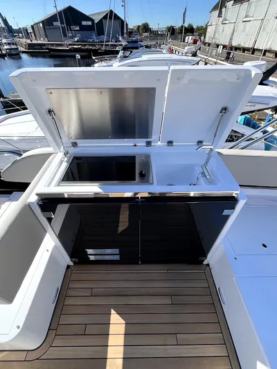 Waypoint Yacht Photos Pics 2024 Fairline Squadron 50 yacht with open deck kitchen at marina.