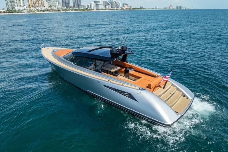 Why Her Yacht Photos Pics 2024 Wajer 55 HT luxury yacht cruising on open water near city skyline.