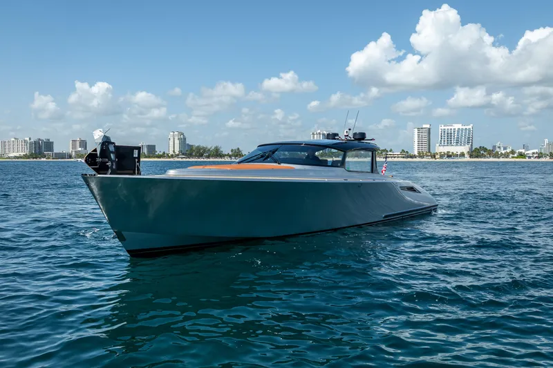 Why Her Yacht Photos Pics 2024 Wajer 55 HT yacht cruising on a sunny day near city skyline.