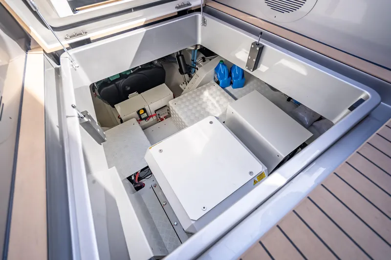 Why Her Yacht Photos Pics Engine compartment of 2024 Wajer 55 HT yacht, showcasing mechanical components and storage.