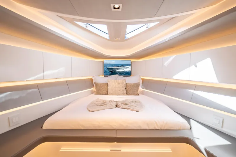 Why Her Yacht Photos Pics Luxurious interior of 2024 Wajer 55 HT yacht with elegant bedding and ambient lighting.
