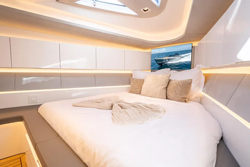 Why Her Yacht Photos Pics Luxurious interior of 2024 Wajer 55 HT yacht with cozy bed and ambient lighting.