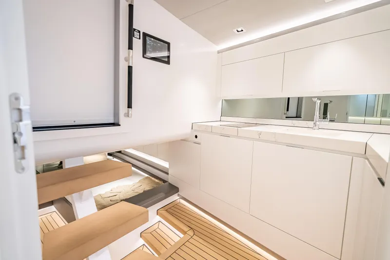 Why Her Yacht Photos Pics Luxurious interior of 2024 Wajer 55 HT yacht with modern kitchen design.
