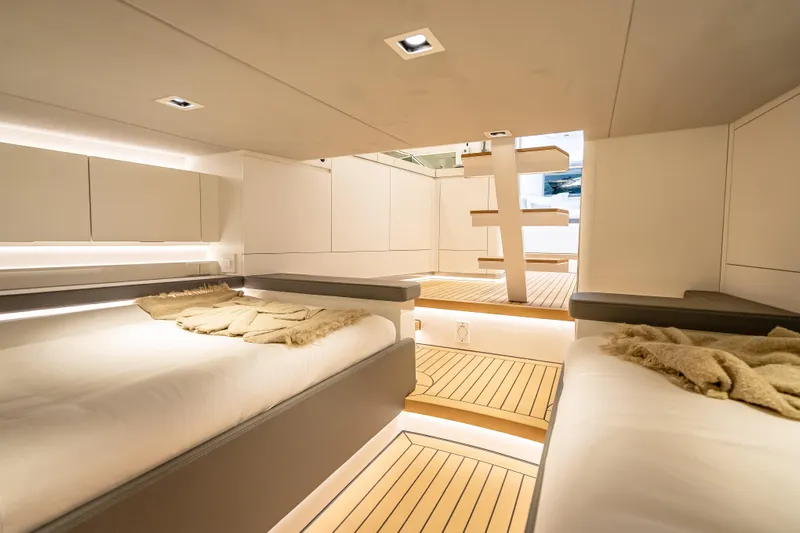 Why Her Yacht Photos Pics Luxurious interior of 2024 Wajer 55 HT yacht with modern design and cozy bedding.