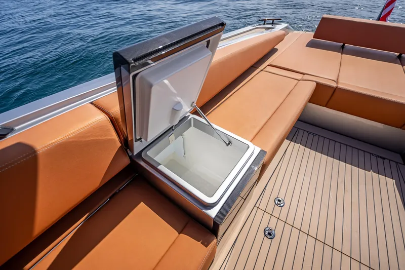 Why Her Yacht Photos Pics 2024 Wajer 55 HT yacht with open storage compartment on deck, featuring tan seating.