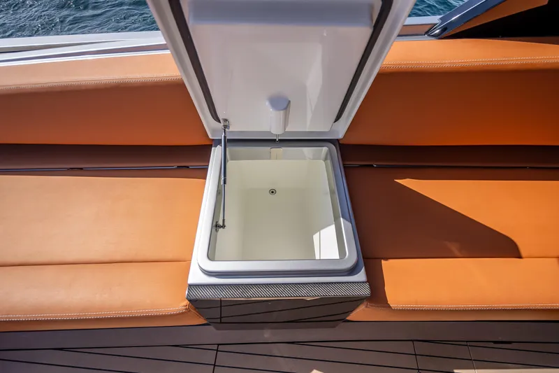 Why Her Yacht Photos Pics Open storage compartment on 2024 Wajer 55 HT yacht with orange seating.