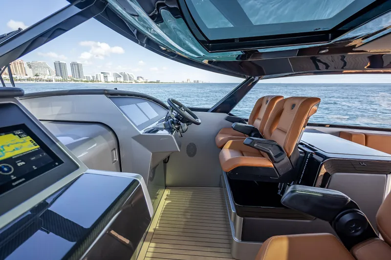Why Her Yacht Photos Pics Luxurious interior of 2024 Wajer 55 HT yacht with modern dashboard and leather seating.
