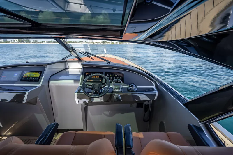 Why Her Yacht Photos Pics Interior view of 2024 Wajer 55 HT yacht cockpit with modern controls and ocean backdrop.