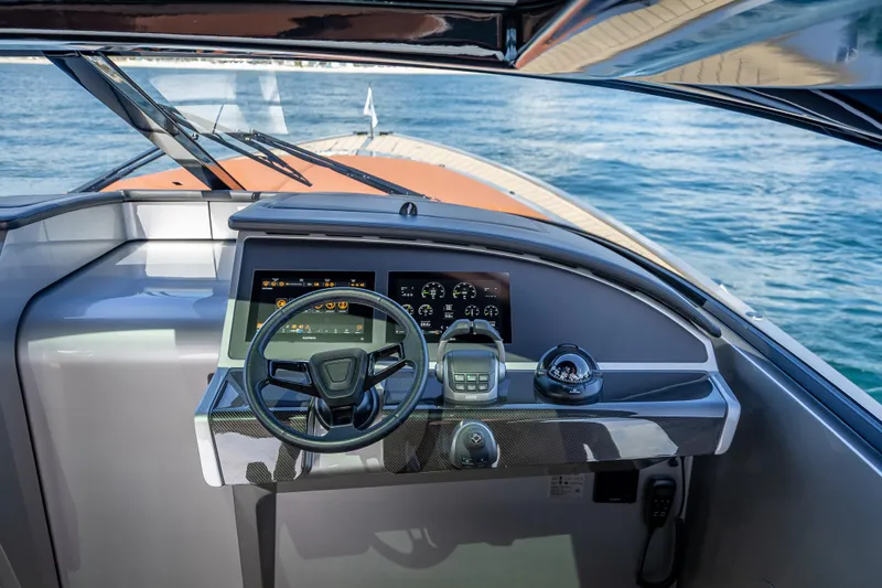 Why Her Yacht Photos Pics Helm of 2024 Wajer 55 HT yacht with modern controls and ocean view.