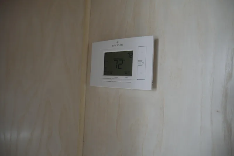  Yacht Photos Pics Digital thermostat on a wooden wall inside a 1996 STARDUST Cruiser.