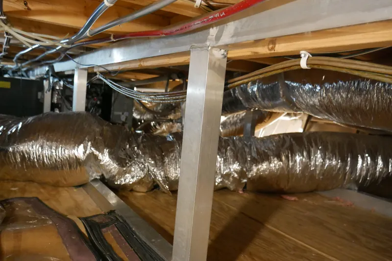  Yacht Photos Pics Crawl space with insulated ductwork and wiring in a 1996 STARDUST Cruiser.