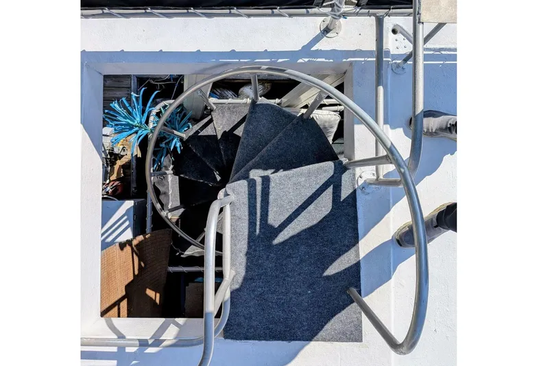  Yacht Photos Pics Spiral staircase on 1996 Stardust Cruisers boat, viewed from above.