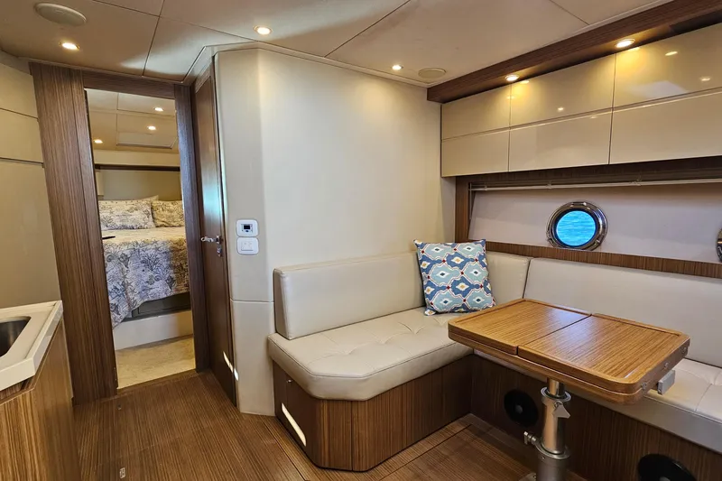  Yacht Photos Pics Luxurious interior of 2015 Azimut Atlantis 50 yacht with cozy seating and elegant wood finishes.