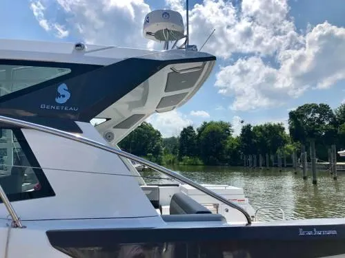  Yacht Photos Pics 2024 Beneteau 36 Gran Turismo GT yacht docked by a scenic river.