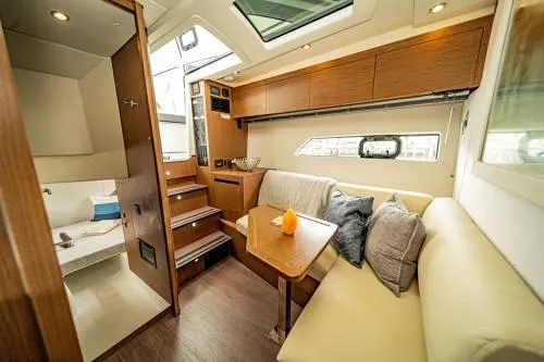  Yacht Photos Pics Interior of 2024 Beneteau 36 Gran Turismo GT yacht with modern seating and wooden finishes.