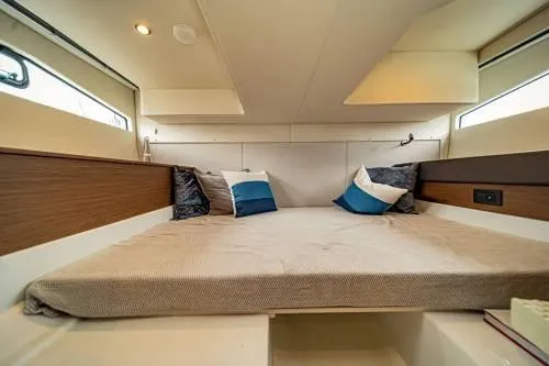  Yacht Photos Pics 2024 Beneteau 36 Gran Turismo GT cabin with cozy bed and pillows.