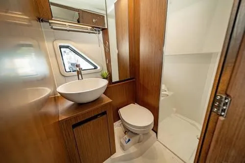  Yacht Photos Pics Modern bathroom in 2024 Beneteau 36 Gran Turismo GT yacht with wood accents.