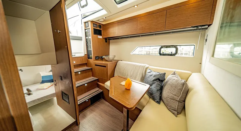  Yacht Photos Pics Interior of 2024 Beneteau 36 Gran Turismo GT yacht with cozy seating area.