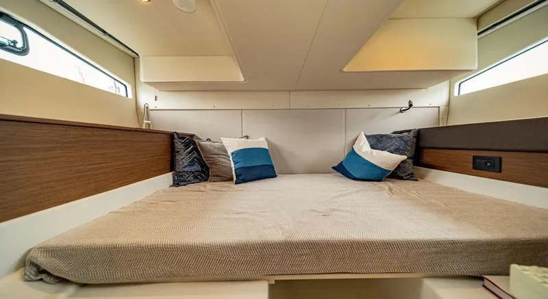  Yacht Photos Pics 2024 Beneteau 36 Gran Turismo GT cabin with cozy bed and pillows.