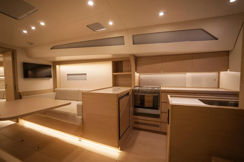 Alias Yacht Photos Pics Luxurious interior of 2014 Adria ORCA 50 yacht with modern kitchen and seating area.