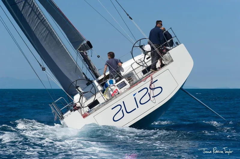 Alias Yacht Photos Pics Sailing yacht Adria ORCA 50, 2014 model, navigating ocean waters with crew on deck.